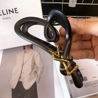 Saint Laurent Cassandre Shark Hair Clip In PVC and Steel with Bamboo Logo Black/Gold