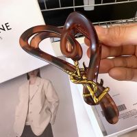 Saint Laurent Cassandre Shark Hair Clip In PVC and Steel with Bamboo Logo Tortoise